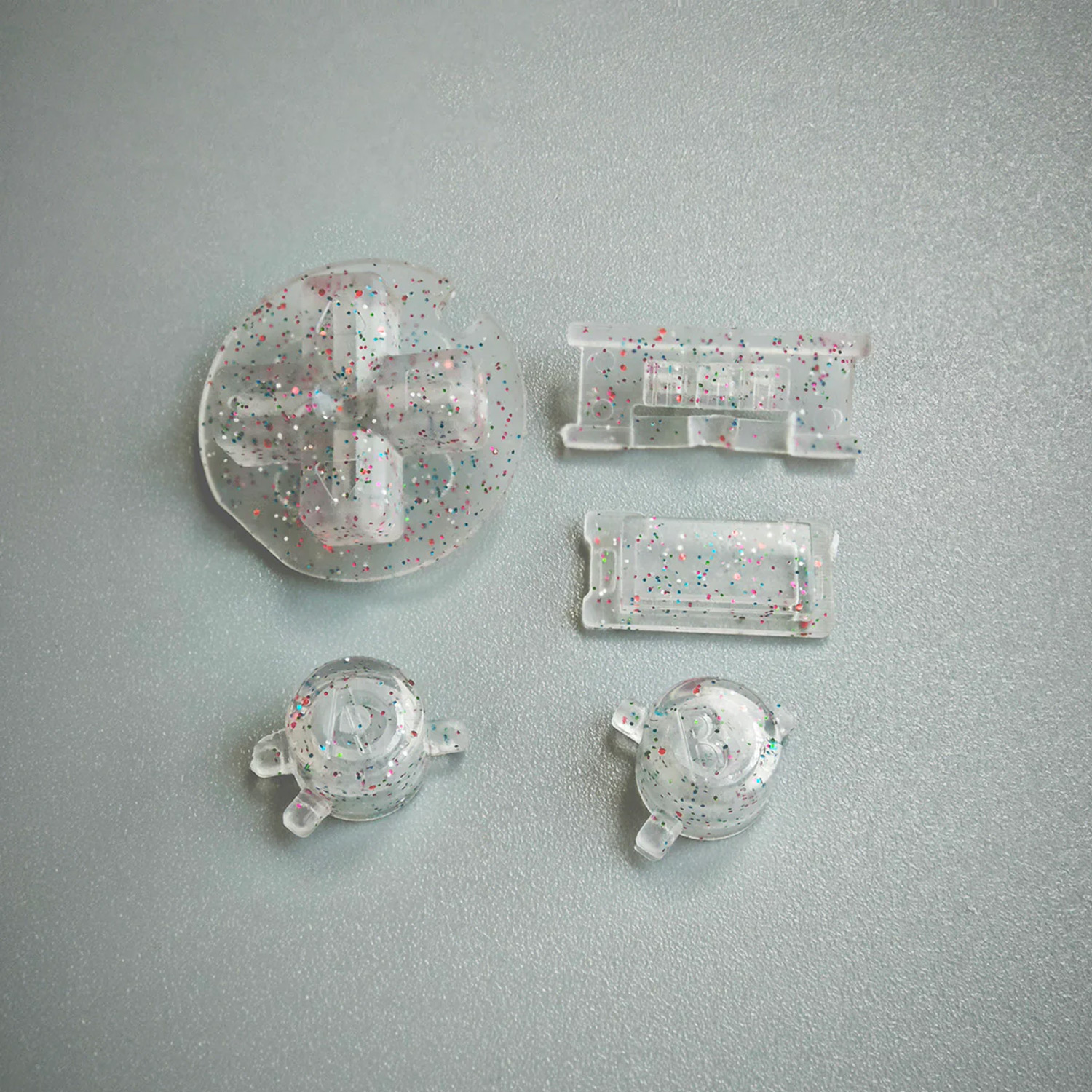 FunnyPlaying buttons for Game Boy Color in different colors (Clear Pearl)